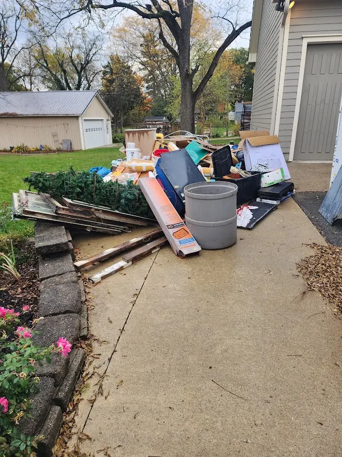 Dumpster being loaded with debris for 30 Yard Dumpster Rental in Stillwater